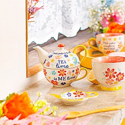 Teiera con tazza incorporata e design floreale