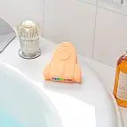 Forma a razzo, colore arancione chiaro e profumo di albicocca