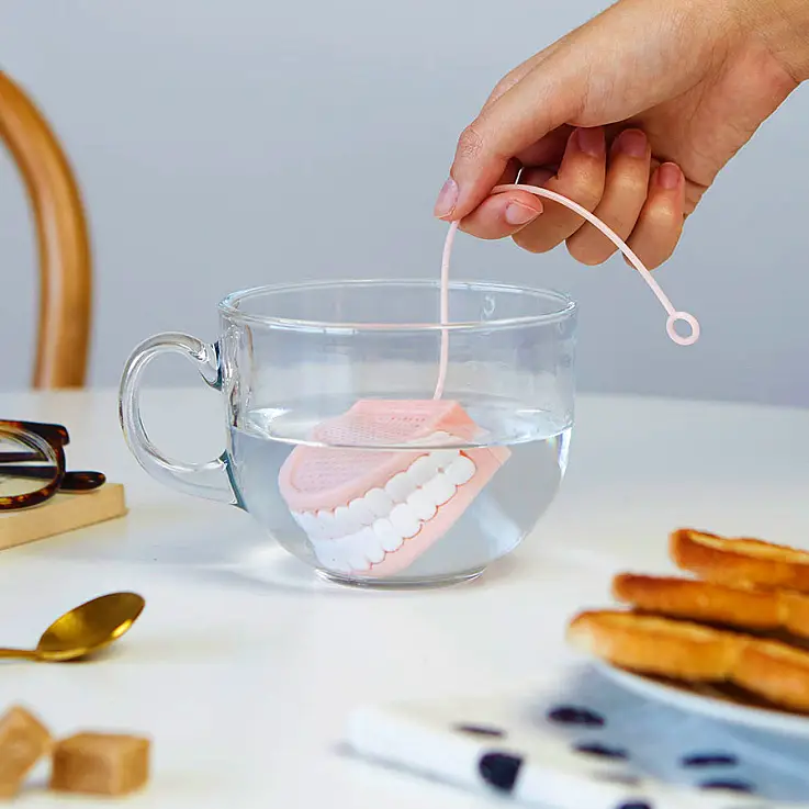 Infusore per tè a forma di dente